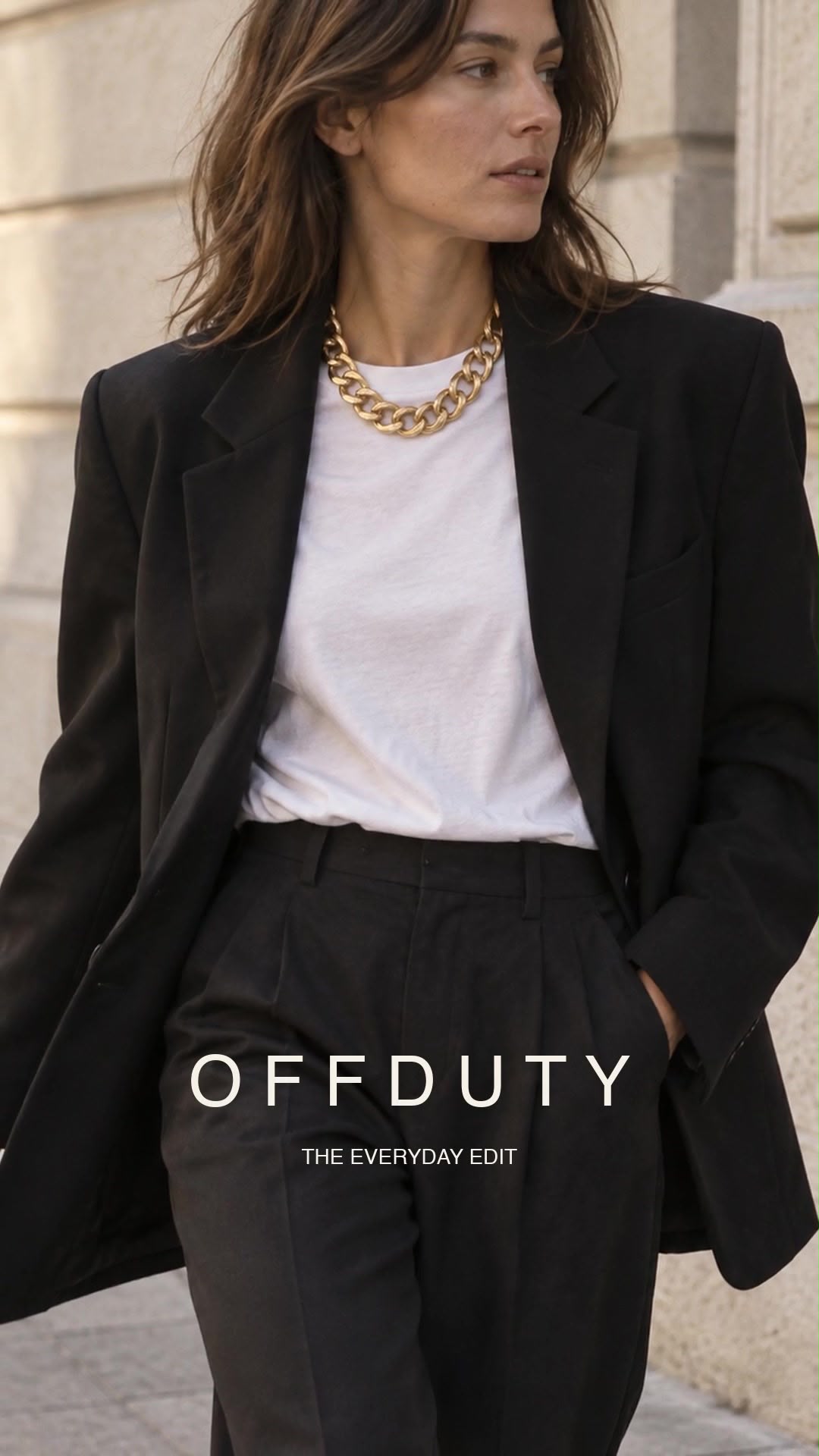 White T-shirt under a black blazer with a chunky gold chain necklace and OFFDUTY text in the image